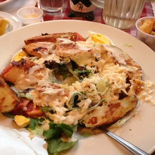 A lot of damage for the fry chicken salad with a basket of garlic bread.