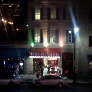 a car parked in front of a restaurant
