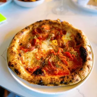 Carne pizza - veal porchetta, fennel sausage pepperoni, mozzarella, pickled peppers, tomato