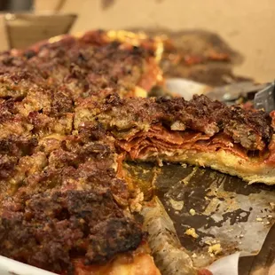 a half eaten pizza in a box