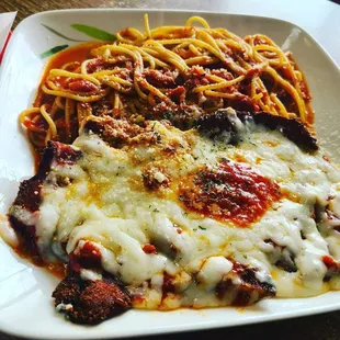 a plate of spaghetti and meat