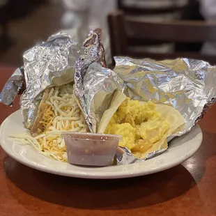 Breakfast tacos.  Egg + cheese, and beans + cheese.  Salsa is great!