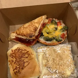 Raspberry turnover, broccoli + cheese mini pizza, ham + cheese bun, and Napoleon cake.