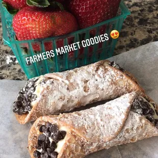 a basket of strawberries and a pastry
