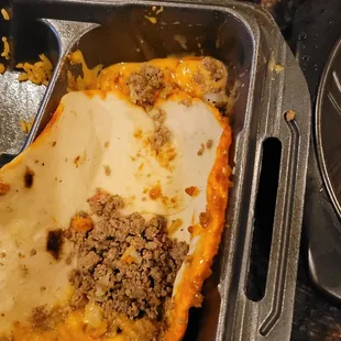 This is how much meat that was in my burrito. He&apos;ll I got more in the extra container