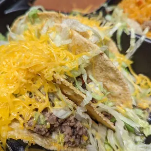 Taco plate order unappealingly slapped together...used to be great tacos lovingly prepared! What happened?