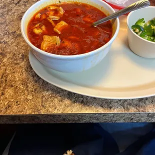 a bowl of soup and a bowl of tortilla