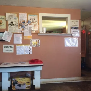a dining room with posters on the wall