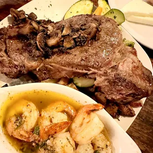 a plate of steak and shrimp