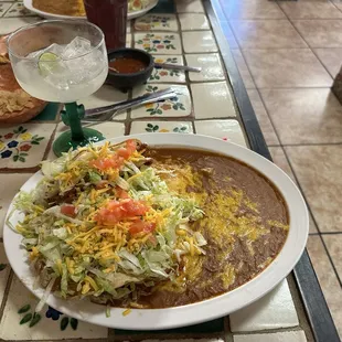 #2 combo. Taco, Tostada and Cheese Enchilada with refried beans.