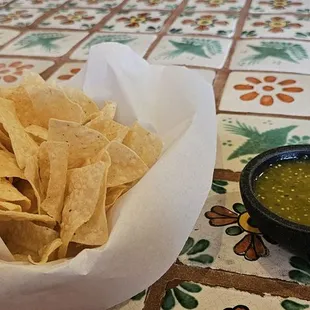 Chips and tomatillo salsa.