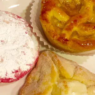 Apple tart, cheese filled pastry and shortbread cookie with powdered sugar