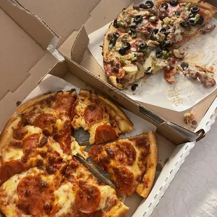 Small Our Famous Deluxe Pizza and small pepperoni pizza.