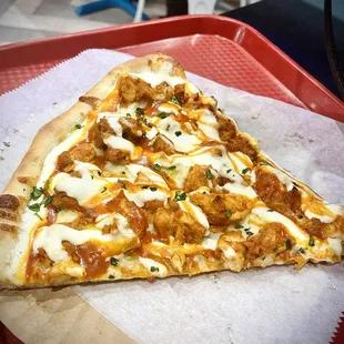 a slice of pizza on a tray