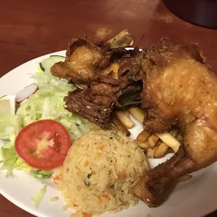 Pollo frito, serv. Rice, fries, and salad