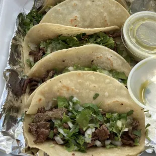 Asada tacos cilantro and onion with green salsa