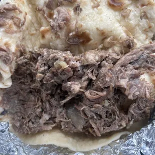 shredded beef on a tortilla