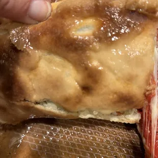 Close up of a grease soaked crust