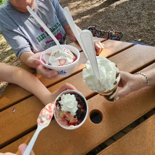 three people eating ice cream