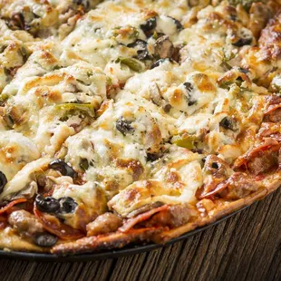 a pizza with cheese and olives