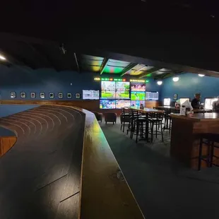 Our upstairs sports lounge, with a full bar, a TV wall, and tons of memorabilia!