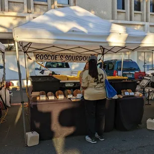 a woman standing under a tent
