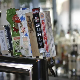 a row of beer taps