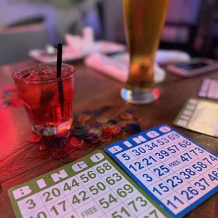 a pint of beer and bingo cards