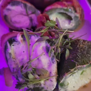 Jalapeño poppers, wrapped in bacon.