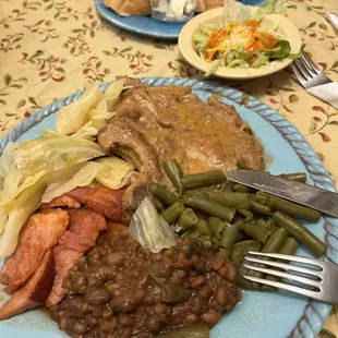 Pork chops, Hawaiian ham, cabbage, green peas, beans.