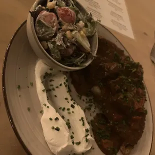  plate of food and a bowl of salad