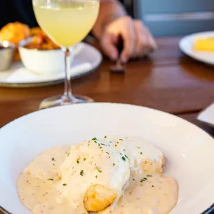 a plate of food and a glass of wine