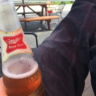 a person holding a beer bottle