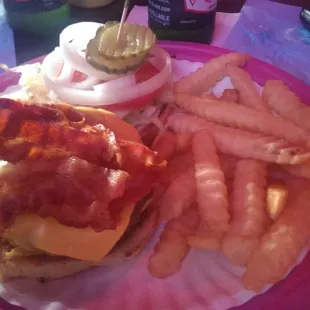 Double bacon cheese burger with fries.
