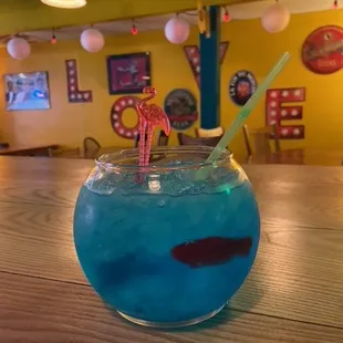 a blue drink in a fish bowl