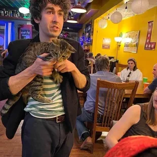 Ricki says if cats are lease trained they can visit. This kitty ran in on a busy night and left before I could buy them a drink.