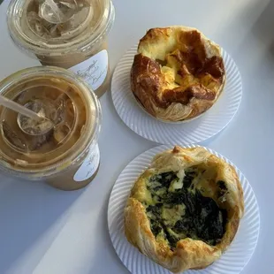 Top: caramel apple latte and cheese soufflé  Bottom: iced vanilla Americano with cream and spinach and cheese soufflé