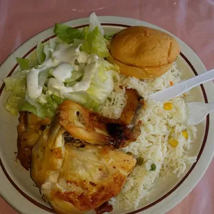 Mmmmmm baked chicken l, white rice,  salad,  and a warm buttery roll. Perfect for this weather!