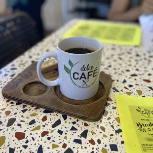 a cup of coffee on a tray