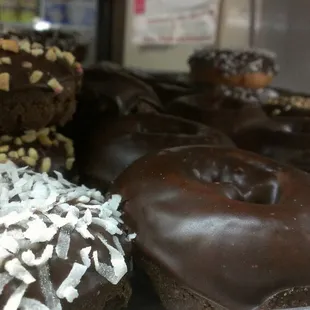 a variety of chocolate donuts