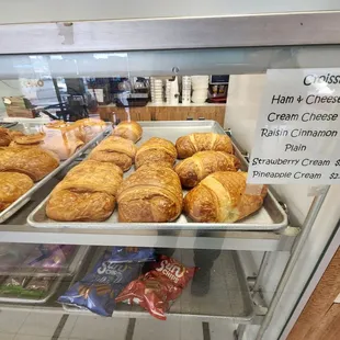 a display case of croissants