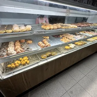 a display case filled with donuts