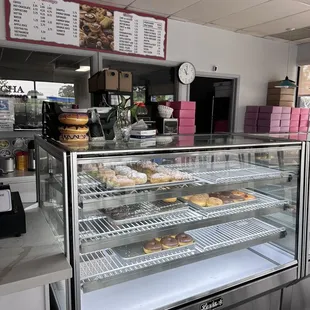 a display case with a variety of donuts