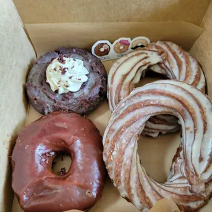 Milk Chocolate Glazed Brioche, Cookies and Cream Old Fashioned, and Triple Vanilla Bean Crullers, plus a cute donut sticker!