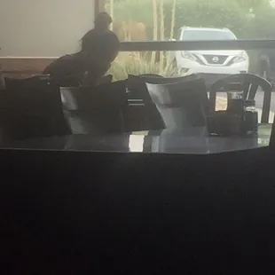 One waitress doing all the work and she sits there