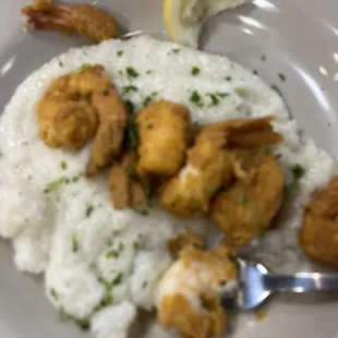 a plate of shrimp and rice