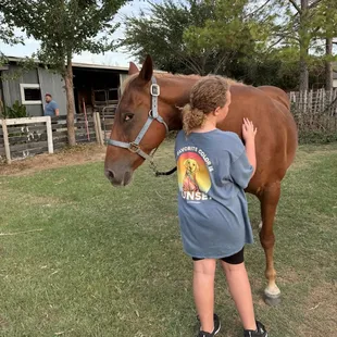 I don't think he trusts me yet but he can't say no to little girl hugs