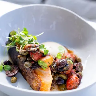 Salmon steak with Puttanesca sauce