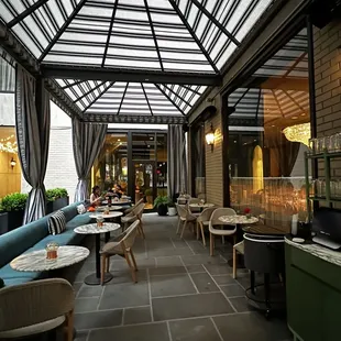 a restaurant with a glass roof