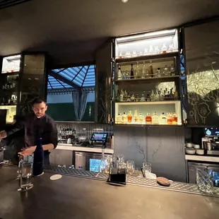 a man standing at a bar